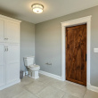 Master Bath – Full overlay, shaker style doors and drawer fronts. Granite top, rustic pine rolling door, Linen closet